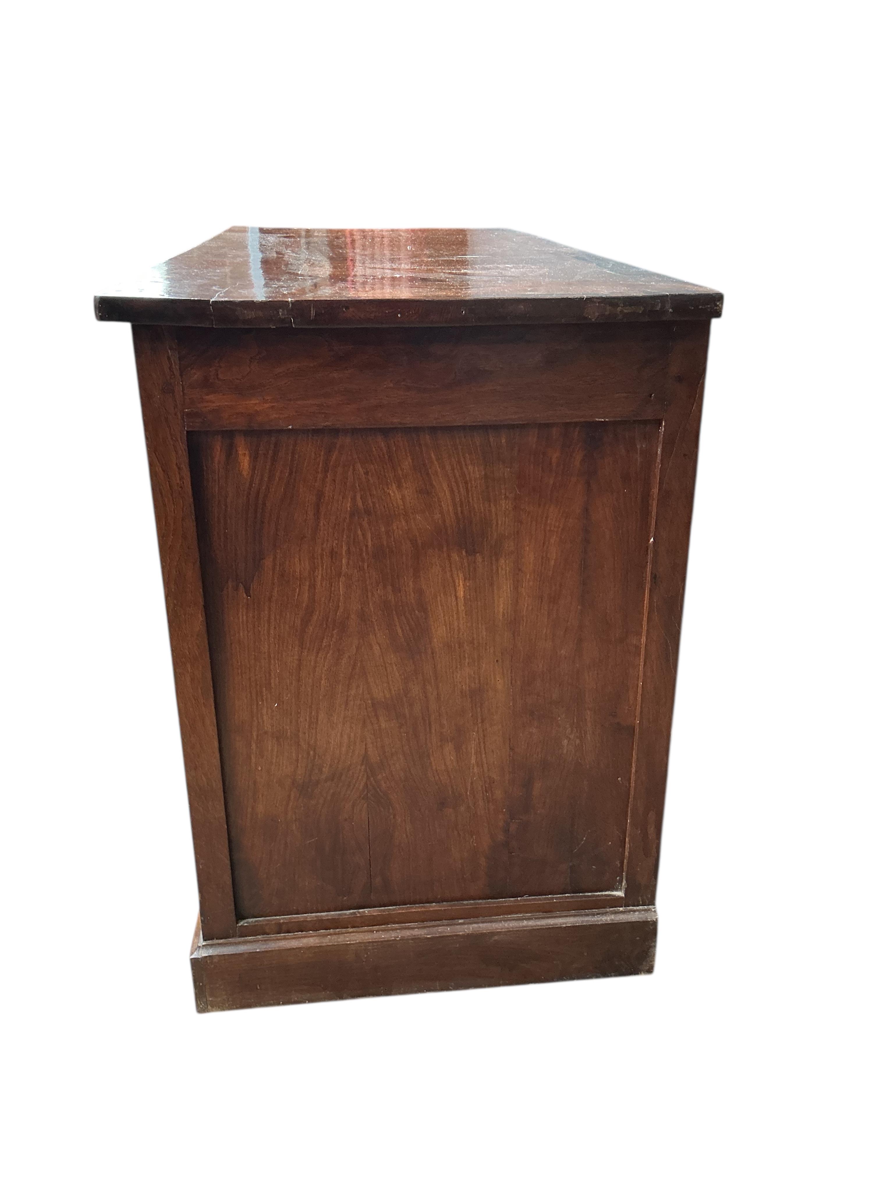 An early 19th century French oak and fruit wood buffet, width 140cm, depth 62cm, height 92cm